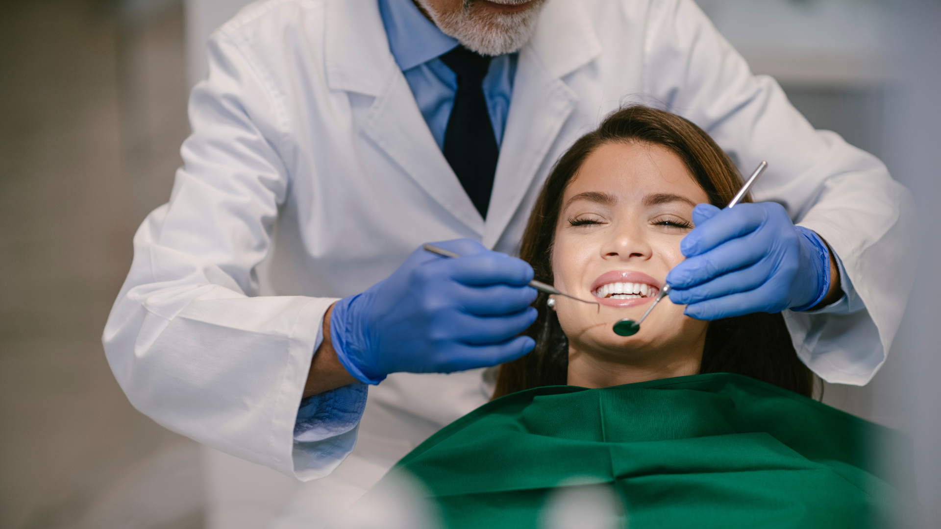 Dentist performing dental procedure